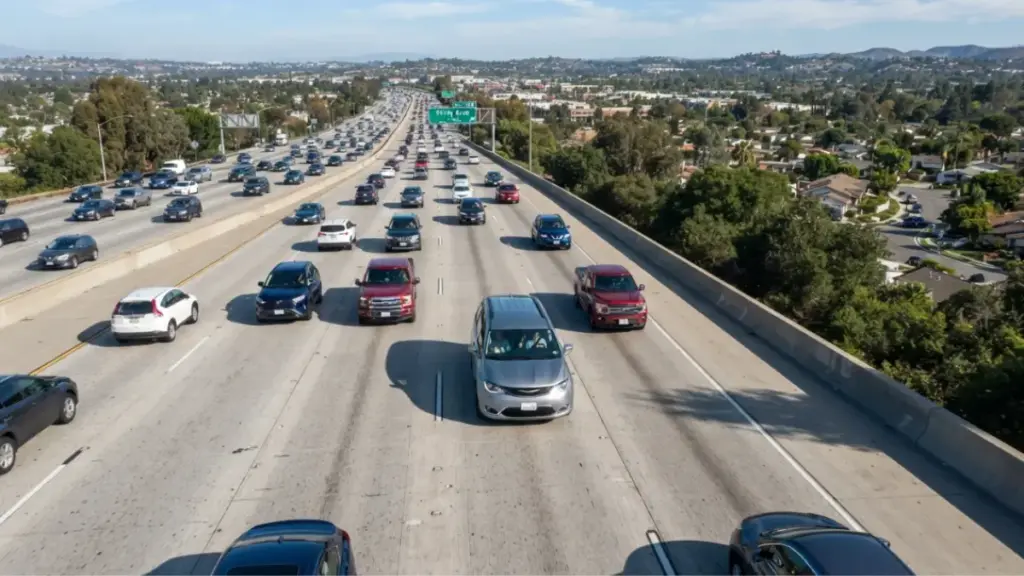 Chrysler Pacifica driving on suburban highway during daylight