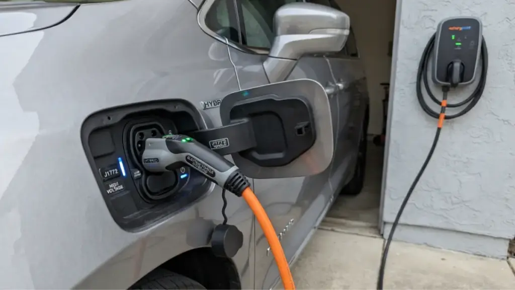 Chrysler Pacifica plug-in hybrid charging port connected to home charger